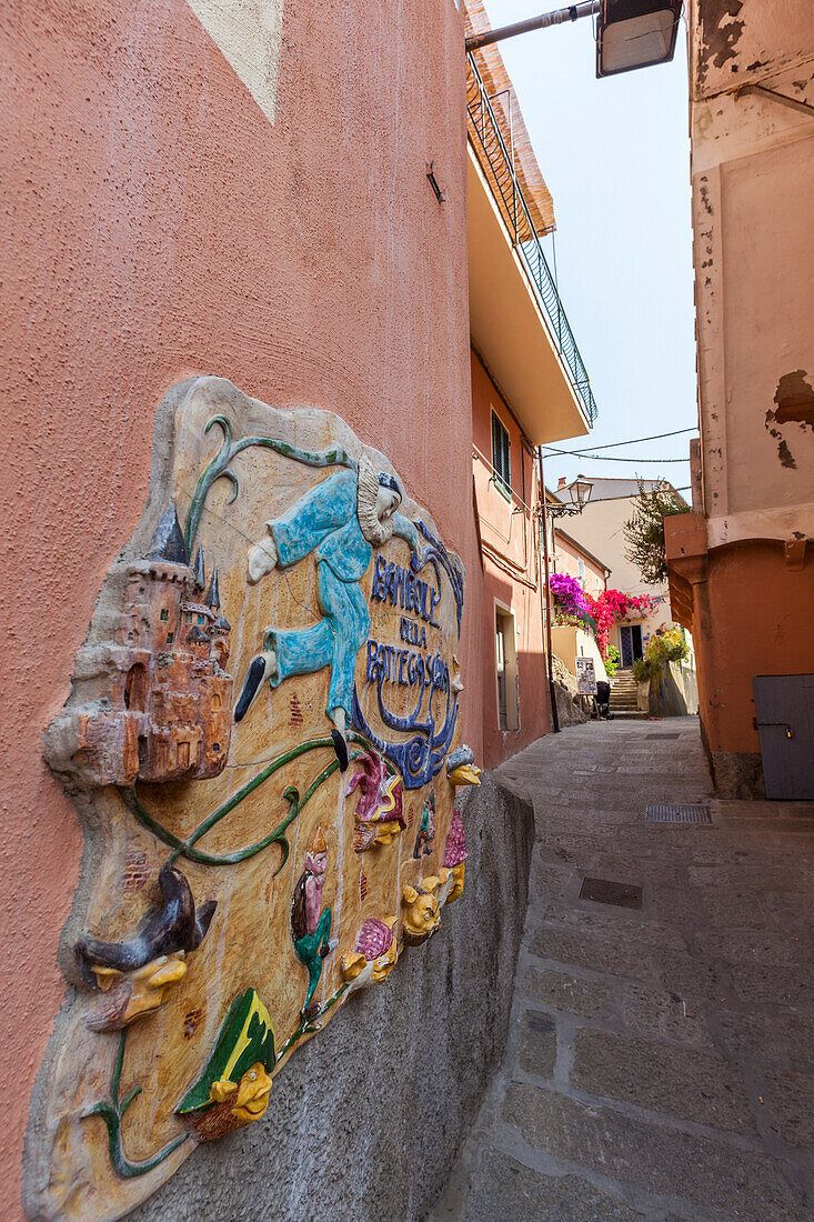 Decorated wall of old alley, Porto Azzurro, Elba Island, Livorno Province, Tuscany, Italy