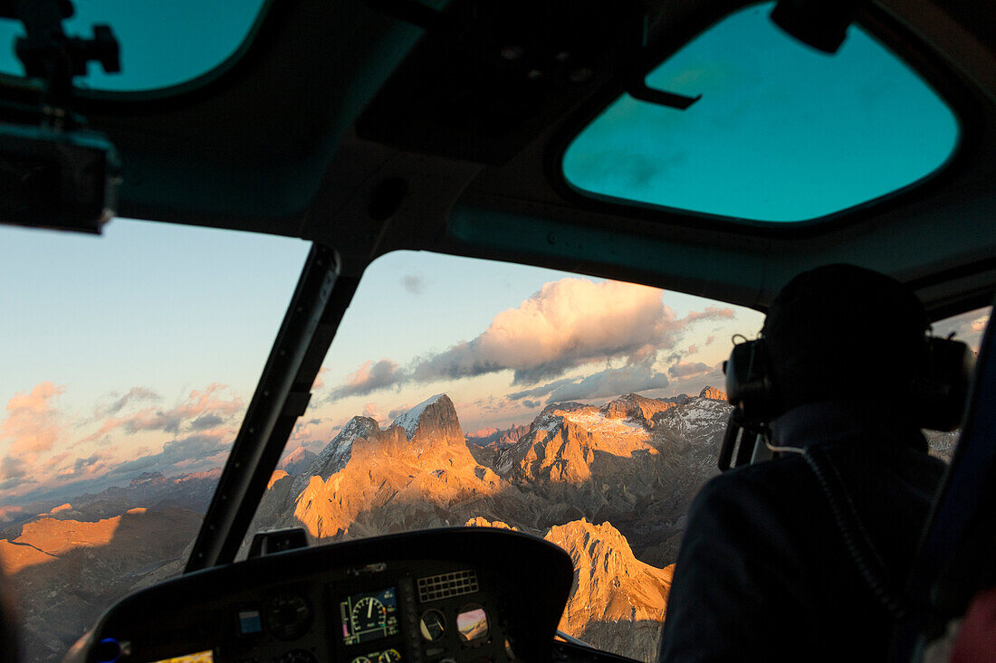 Interior of the cockpit of helicopter in flight on the Dolomites, South Tyrol, Italy