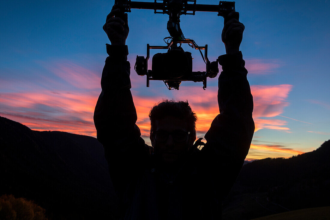 Silhouette of a drone pilot, Dolomites, South Tyrol, Italy