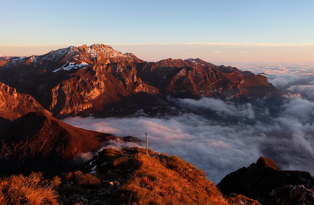 Sunset from Mount Coltignone toward Resegone di Lecco at sunset in winter, piani dei resinelli, abbadia lariana, province of lecco, lombardy, italy, europe