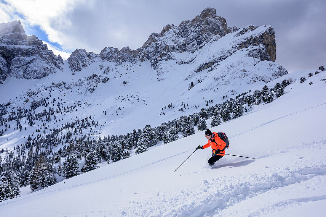 Man backcountry skiing descending from Medalges, Medalges, Natural Park Puez-Geisler, UNESCO world heritage site Dolomites, Dolomites, South Tyrol, Italy