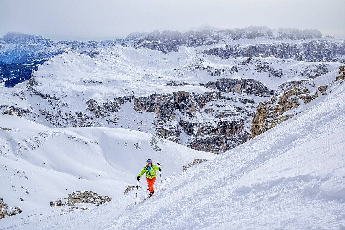 Woman backcountry skiing ascending to Puezspitze, Puezspitze, Natural Park Puez-Geisler, UNESCO world heritage site Dolomites, Dolomites, South Tyrol, Italy