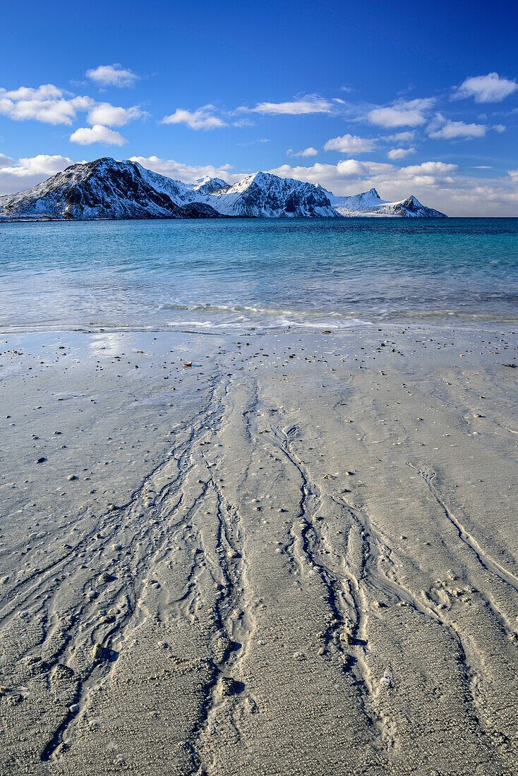 Sandy beach with snow-covered mountains, Lofoten, Nordland, Norway