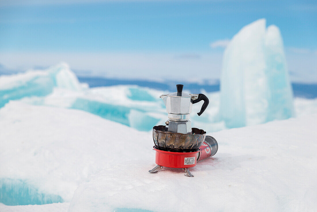 Italian coffe machine Moka on the blocks of ice, Lake Baikal, Irkutsk region, Siberia, Russia