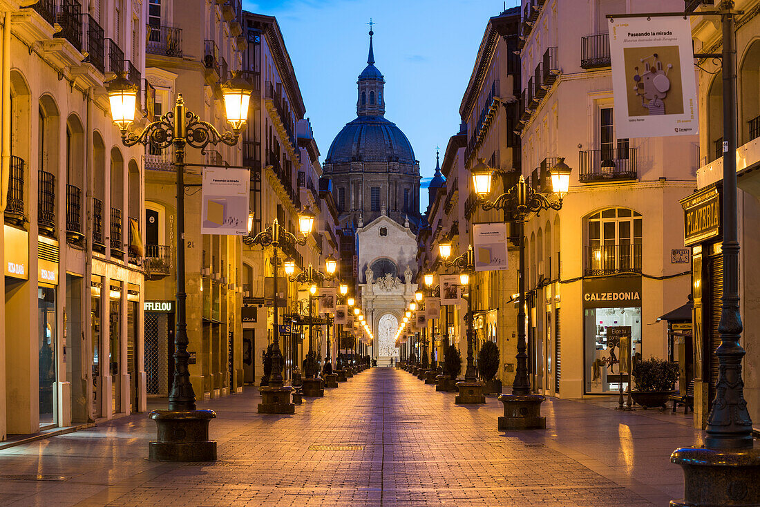 Calle Alfonso and the Cathedral of Our Lady of the Pillar at dusk. Zaragoza, Aragon, Spain, Europe