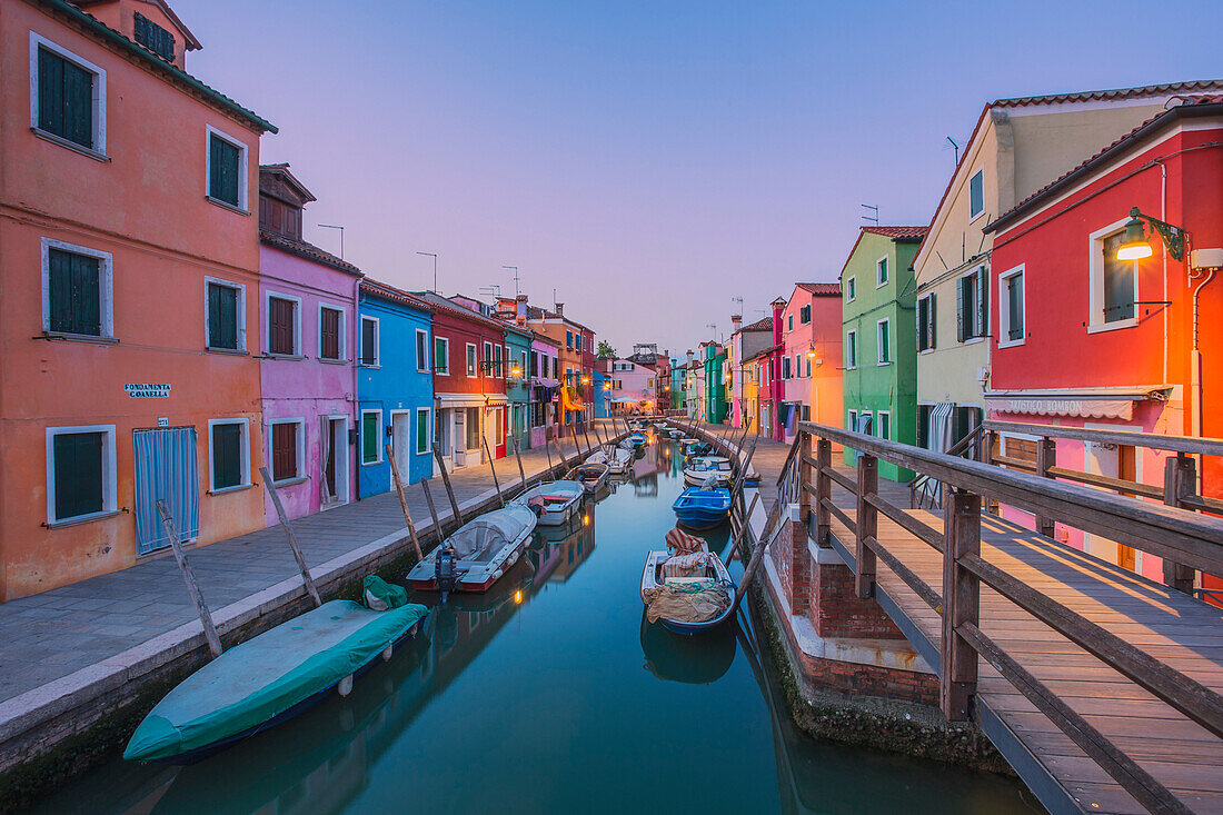 Canal and colorful houses in the evening on Burano Island, Venice, Italy