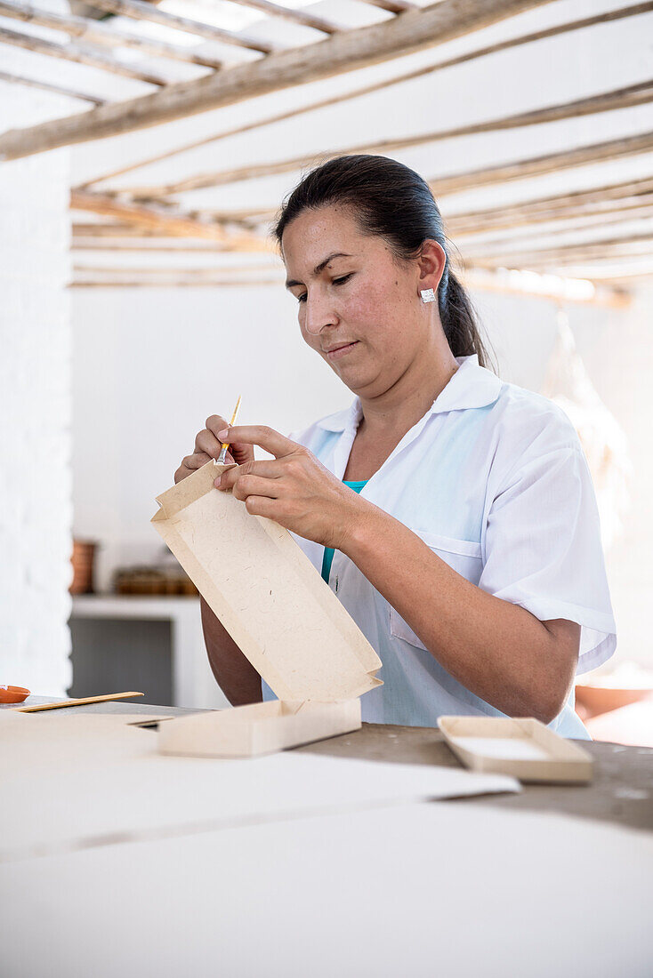 workers producing diverse things with their fine art paper, historical Paper Production at Fundación San Lorenzo, Barichara, Departmento Santander, Colombia, Southamerica