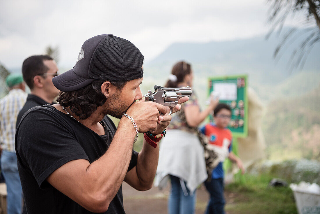 Colombian aiming with toy weapon, Salento, UNESCO World Heritage Coffee Triangle, Departmento Quindio, Colombia, Southamerica