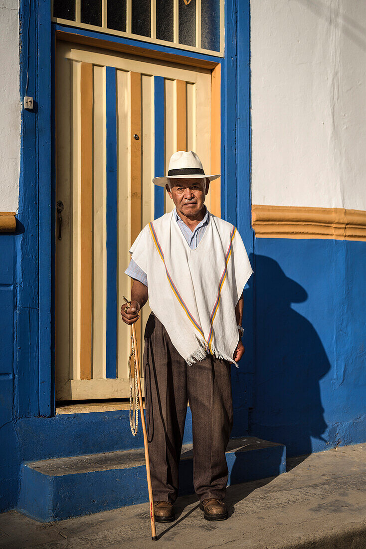 portrait of old man  with stick and hat in front of colonial house, Salento, UNESCO World Heritage Coffee Triangle, Departmento Quindio, Colombia, Southamerica