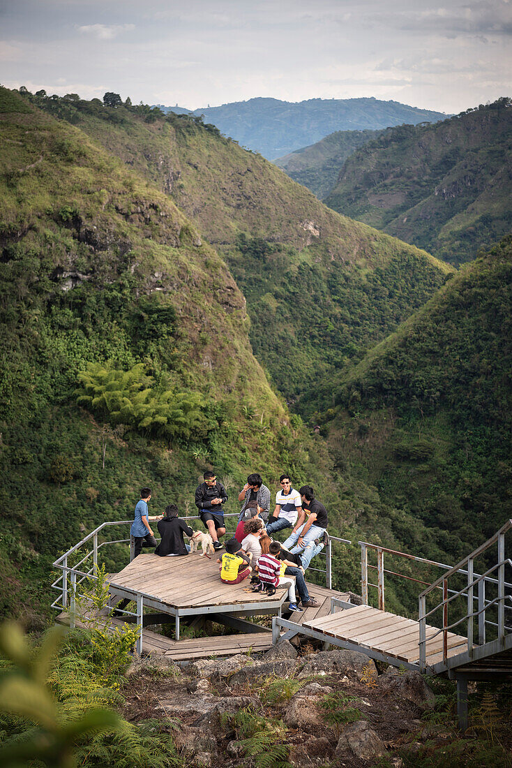 juvenile colombiuan travellers rest at viewing platform at Magdalena river gorge, archaeological excavation site La Chaquira, San Agustin, archaeological park, UNESCO Weltkulturerbe, Departmento Huila, Colombia, Southamerica