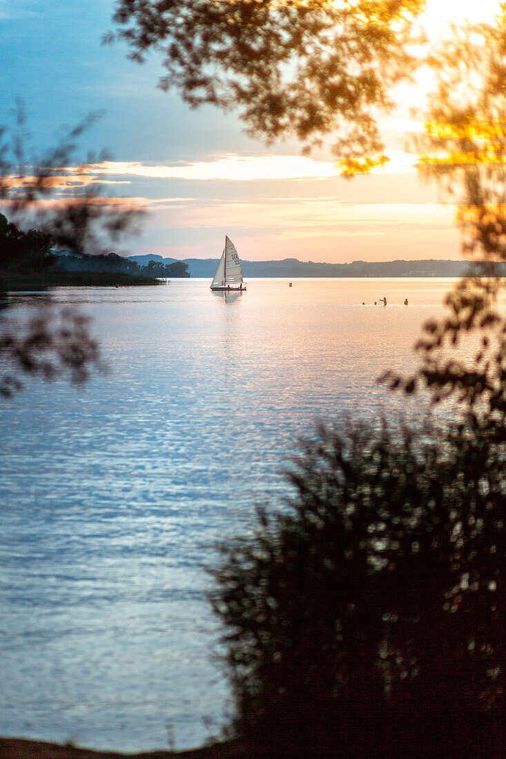 Sailboat on the summer Lake Chiemsee, Bavaria, Germany