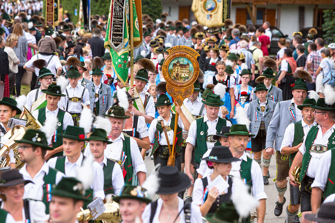 Musicians and people in Bavarian costumes from wild operator in the Chiemgau the pageant in unterwössen