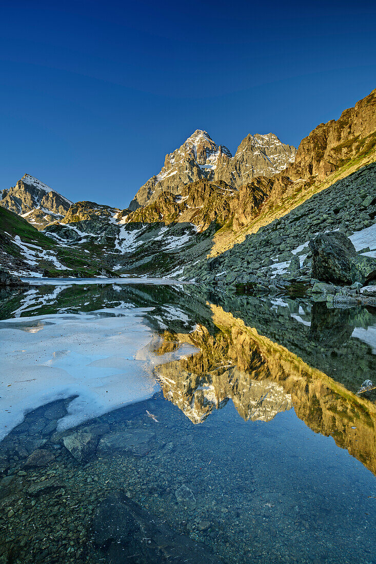 Monviso reflecting in mountain lake, Monte Viso, Monviso, valley valle di Po, Cottian Alps, Piedmont, Italy