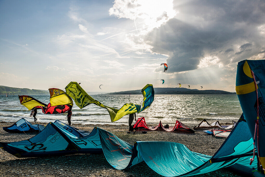 Kitesurfers and windsurfers in storm, on Lake Constance, Reichenau island, Baden-Württemberg, Germany