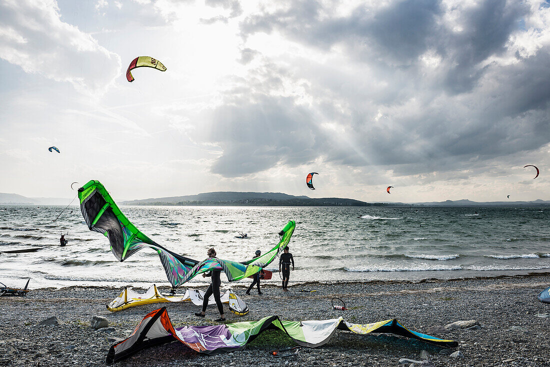 Kitesurfers and windsurfers in storm, on Lake Constance, Reichenau island, Baden-Württemberg, Germany