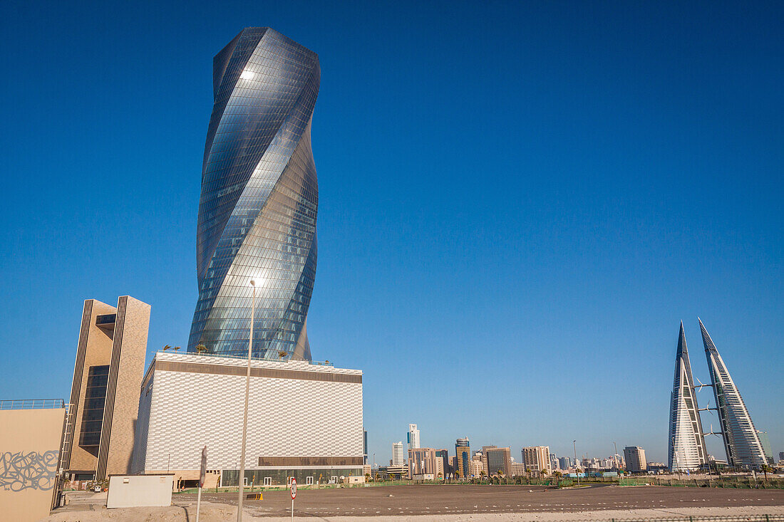 skyline of manama with the luxury hotel four seasons bahrain bay, the wyndham grand manama hotel and the twin towers of the bahrain world trade center, contemporary architecture, manama, kingdom of bahrain, persian gulf, middle east