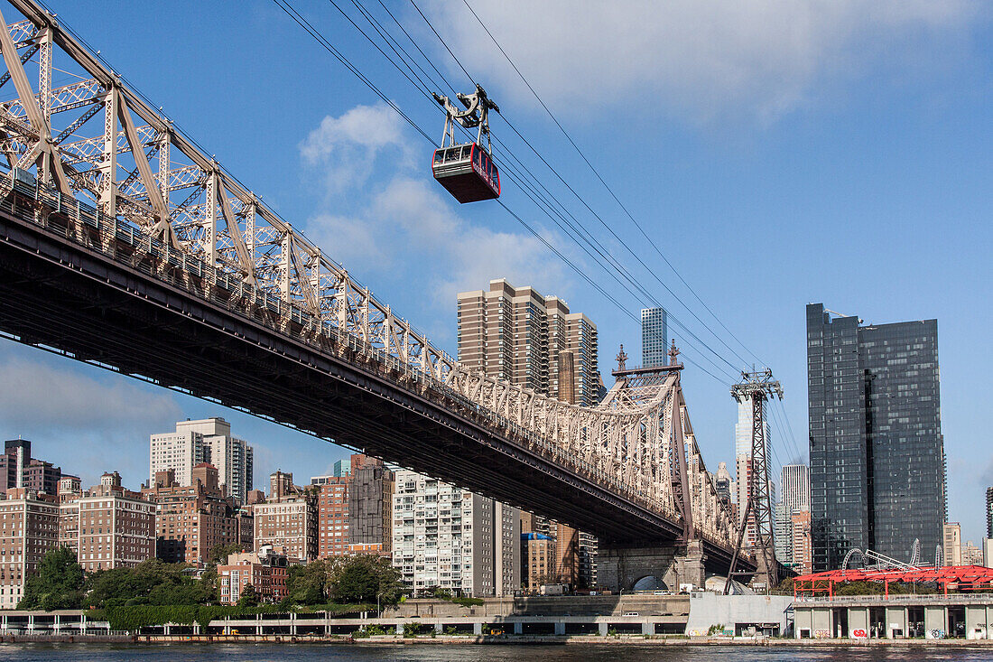 cabin of the roosevelt island aerial tramway over the east river and the queensboro bridge, cable car built by the french company poma, manhattan, new york city, new york, united states, usa