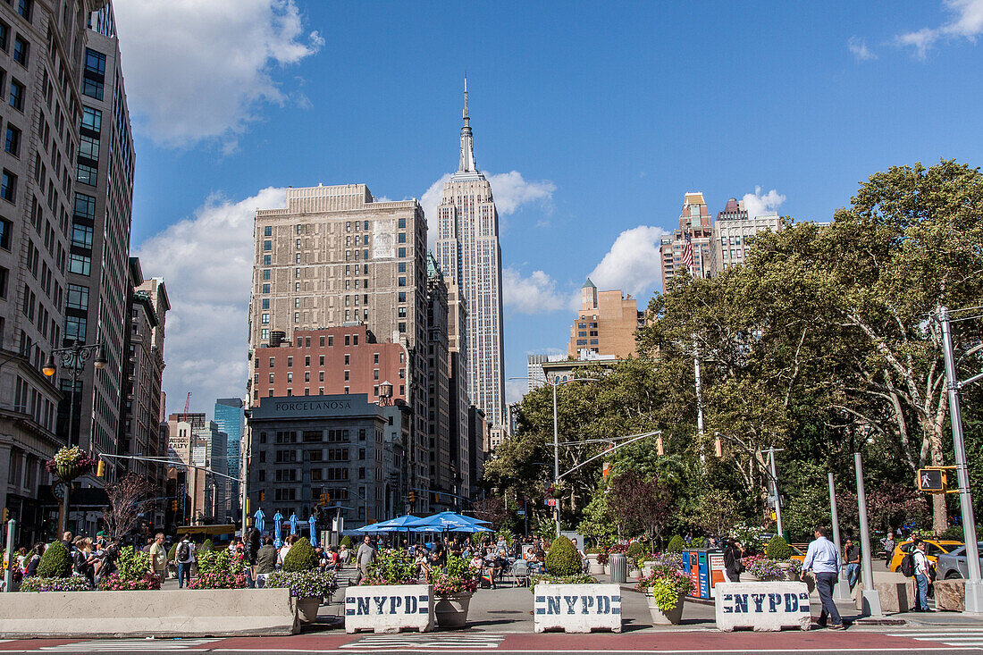 perspective of the empire state building and the buildings of midtown from madison square park, midtown manhattan, new york city, new york, united states, usa