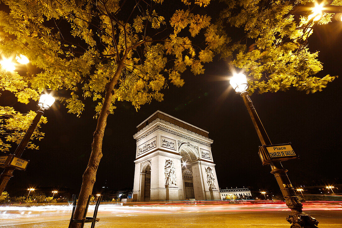 Paris, Place Charles de Gaulle, the Arc de Triomphe by night.