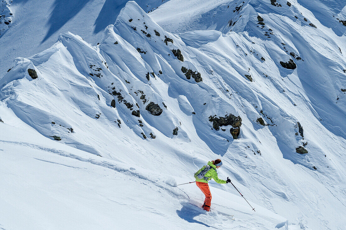 Woman backcountry-skiing descending from Hoher Bolz, Hoher Bolz, Kreuzeck Group, Hohe Tauern range, Carinthia, Austria