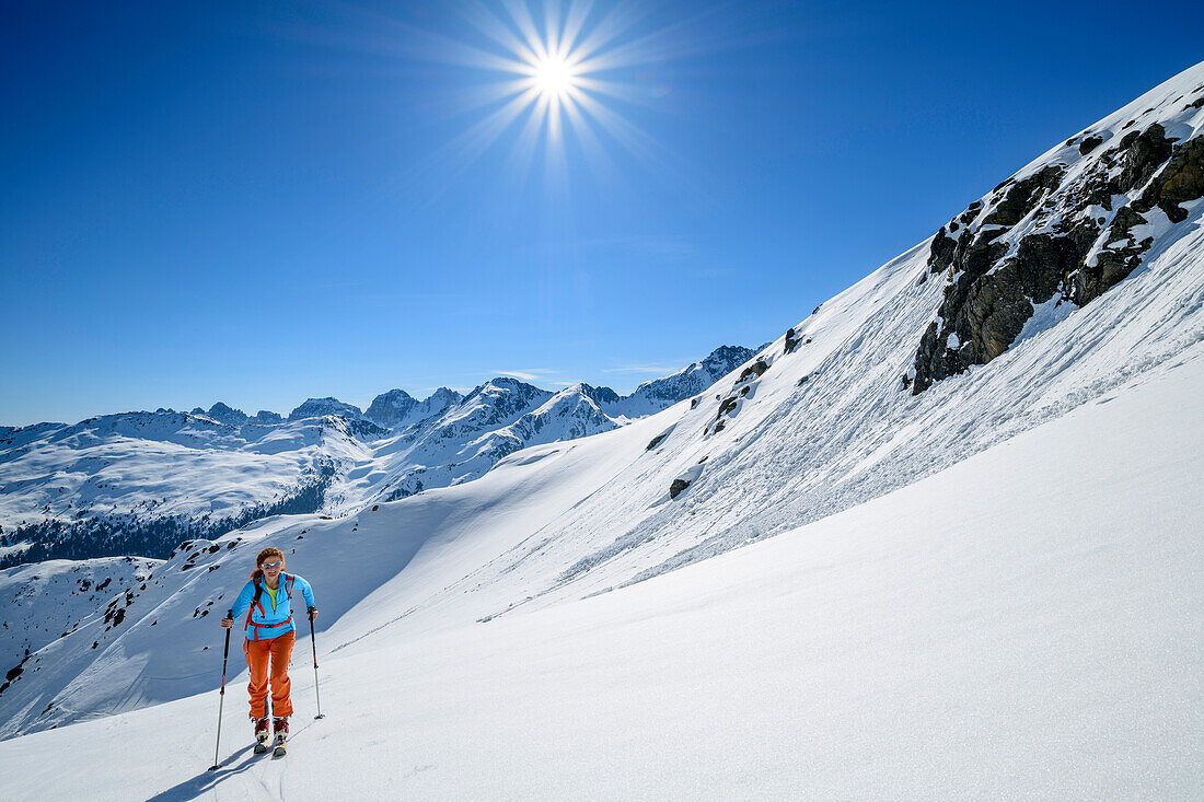 Woman backcountry-skiing ascending towards Soemen, Soemen, Sellrain, Stubai Alps, Tyrol, Austria