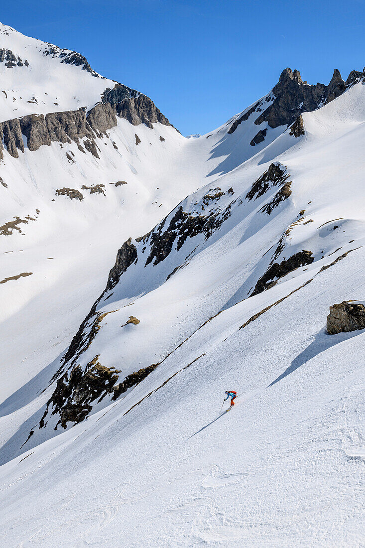 Person backcountry-skiing descending from Wilde Kreuzspitze, Wilde Kreuzspitze, valley of Pfitschtal, Zillertal Alps, South Tyrol, Italy