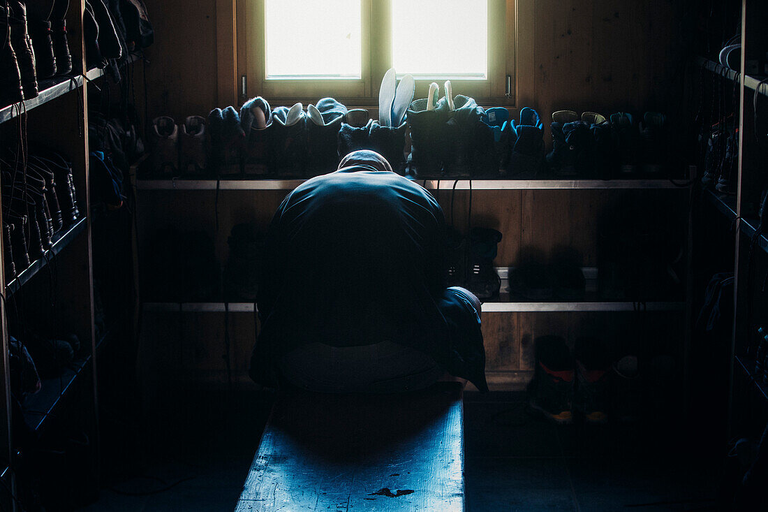 Climbers putting on their shoes in the Memminger hut, E5, Alpenüberquerung, 2nd stage, Lechtal, Kemptner Hütte  to Memminger Hütte, tyrol, austria, Alps