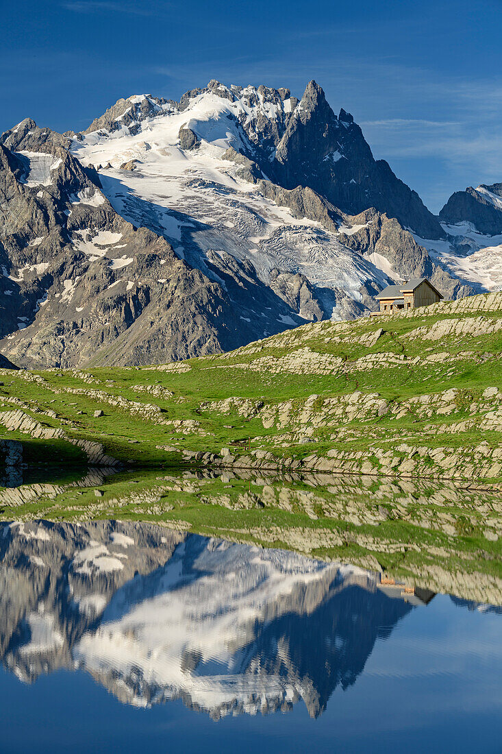 Lake Lac du Goléon with hut Refuge du Goléon and view towards Meije in Ecrins region, lake Lac du Goléon, National Park Ecrins, Dauphine, Dauphiné, Hautes Alpes, France