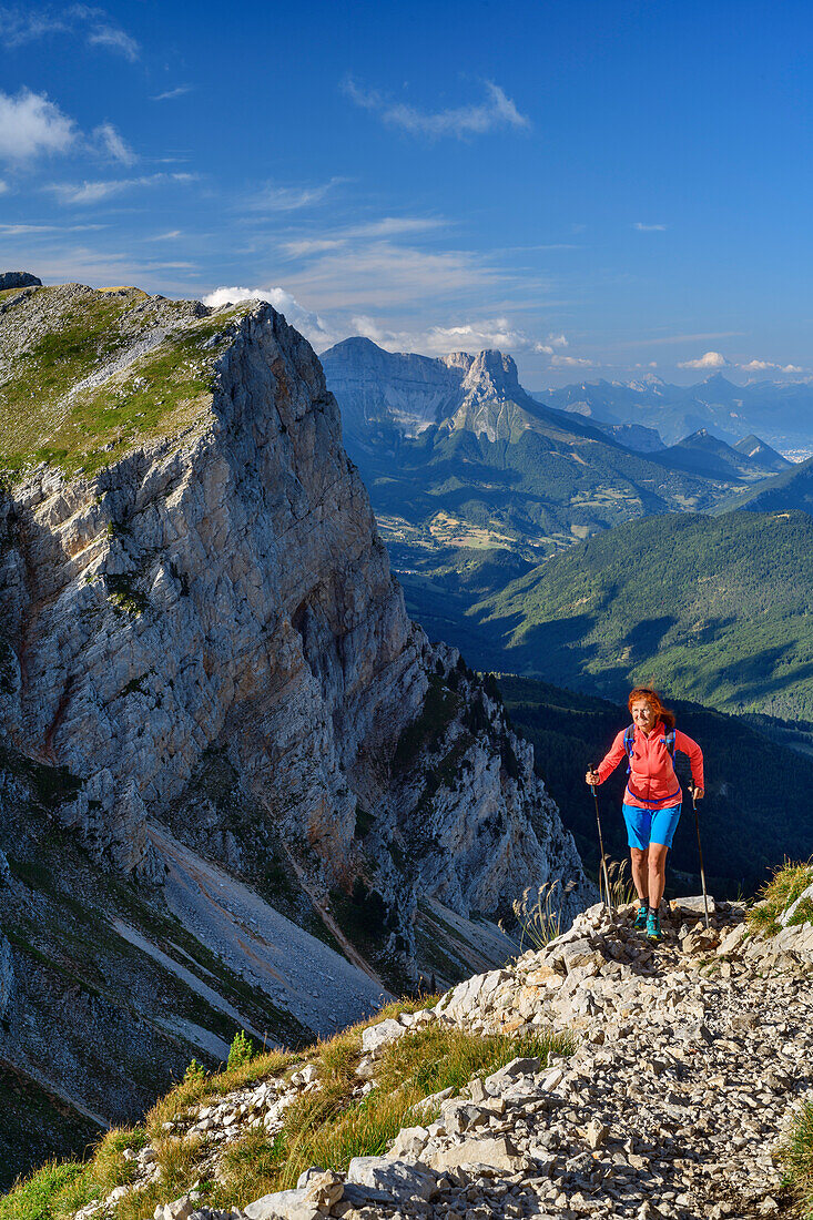 Woman while hiking the Grand Veymont rises on, Grand Veymont, Vercors, Dauphine, Dauphine, Isère, France