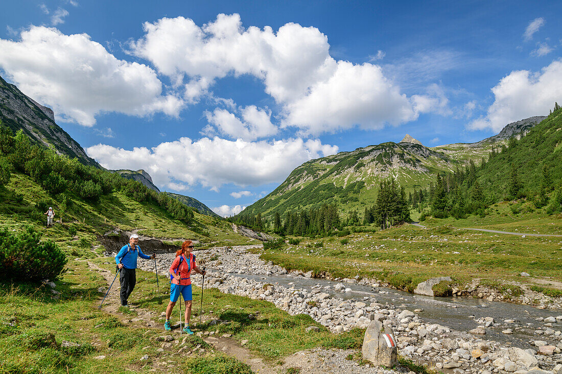 A man and a woman, Lechweg hiking on lechweg, Lech source mountains, Vorarlberg, Austria