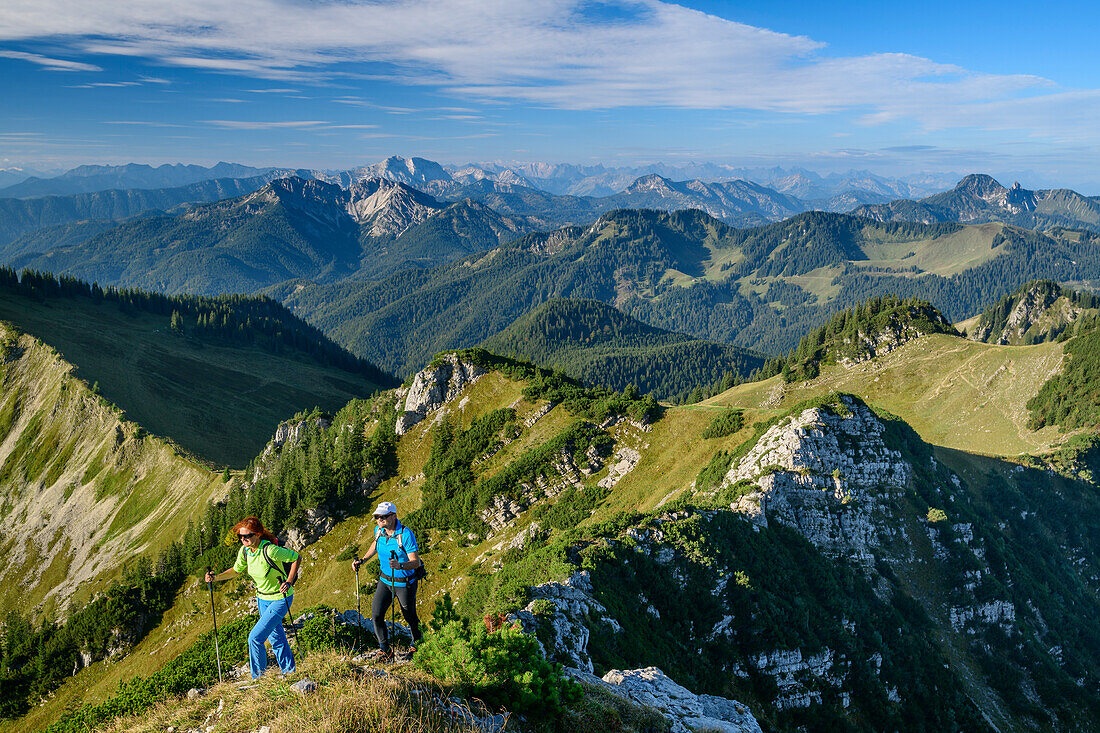 A man and a woman walking on, rising to the Aiplspitze Aiplspitze, Mangfall Mountains, the Bavarian Alps, Upper Bavaria, Bavaria, Germany