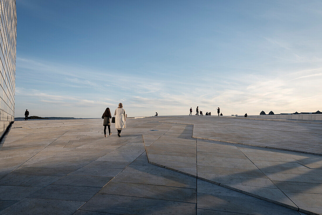 few people walk at roof of opera, the New Opera House in Oslo, Norway, Scandinavia, Europe