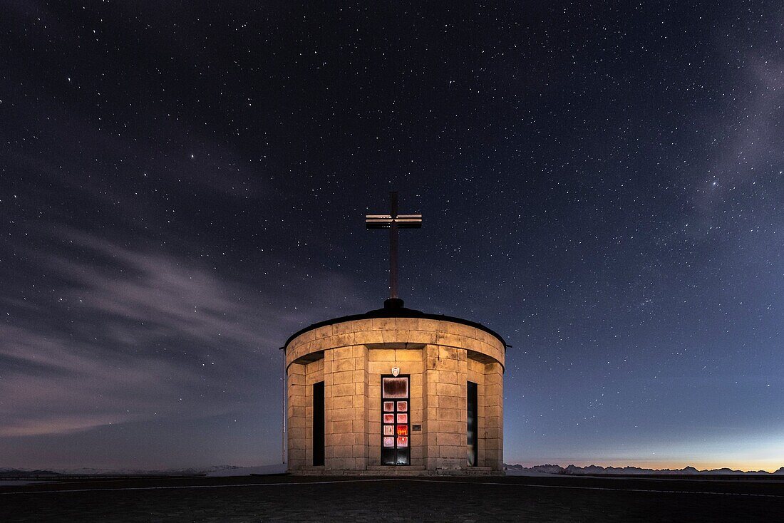 Monte Grappa, province of Vicenza, Veneto, Italy, Europe. On the summit of Monte Grappa there is a military memorial monument. Starry sky over the Sanctuary Madonna del Grappa.