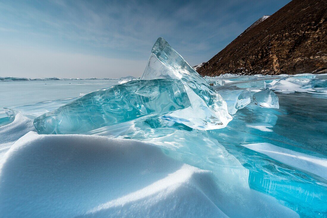 Pieces of transparent ice with sun reflection at lake Baikal, Irkutsk region, Siberia, Russia.