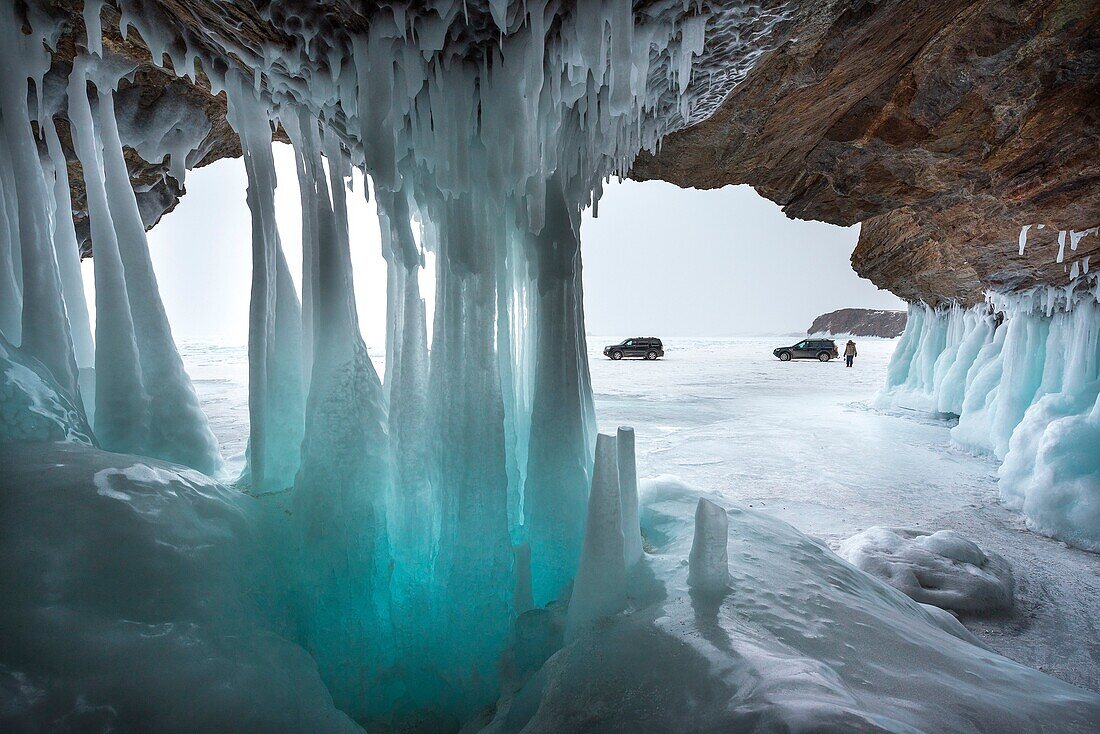 Ice stalactites in a cave at the shore at lake Baikal, Irkutsk region, Siberia, Russia.