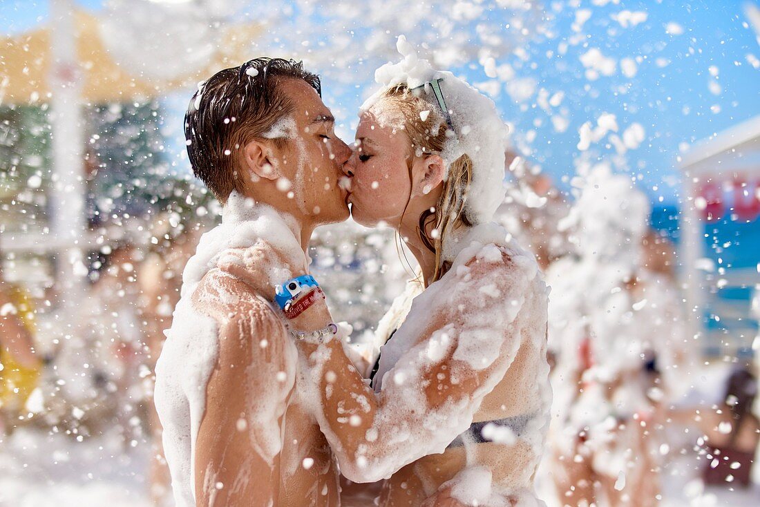 Couple kissing at foam party. Chersonissos. Crete, Greece.