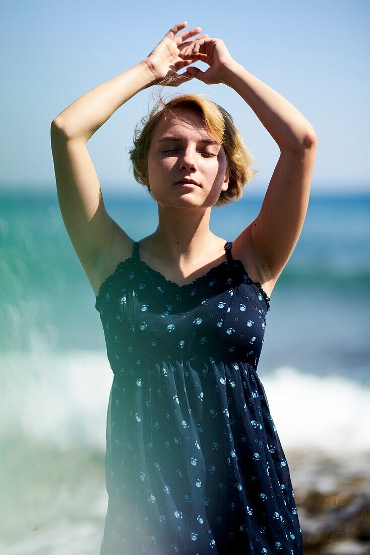 Woman at beach in holiday destination Chersonissos, Crete, Greece, sensual, breeze, holiday