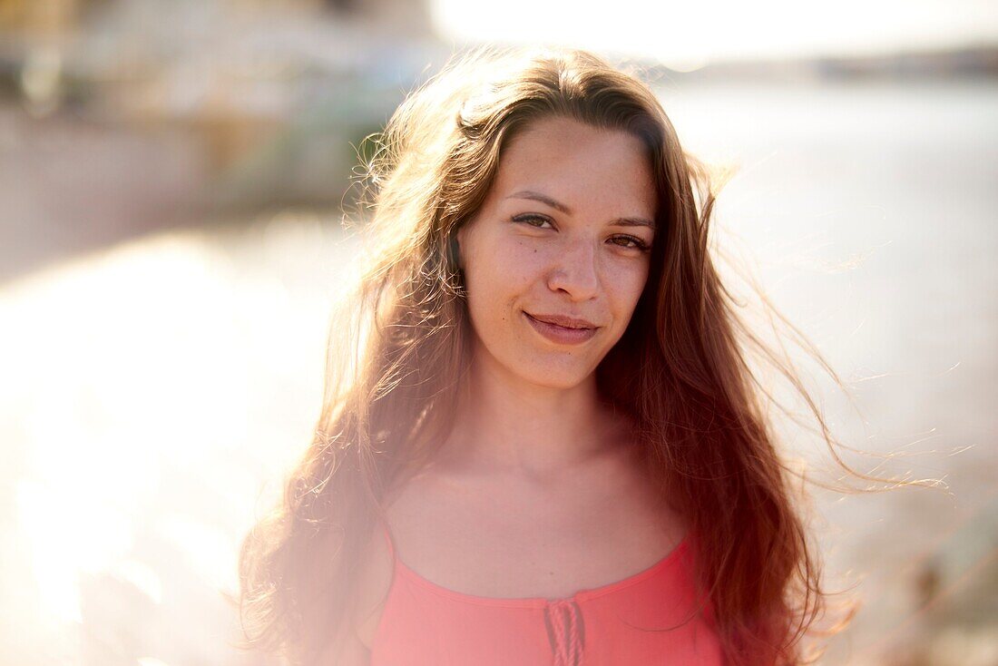 Portrait of woman at beach in beautiful sunlight in holiday destination Chersonissos, Crete, Greece