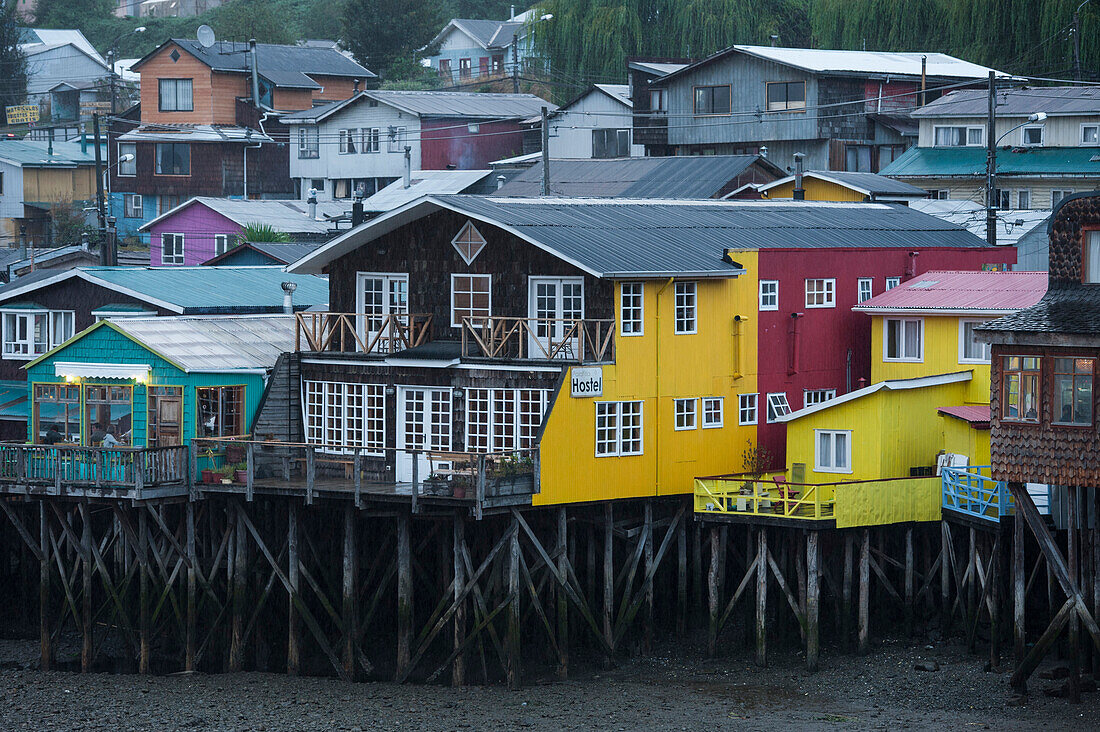 Colorful wooden stilt-houses (palafitos) along the Fiordo de Castro, Castro, Chiloe Island, Los Lagos, Patagonia, Chile, South America