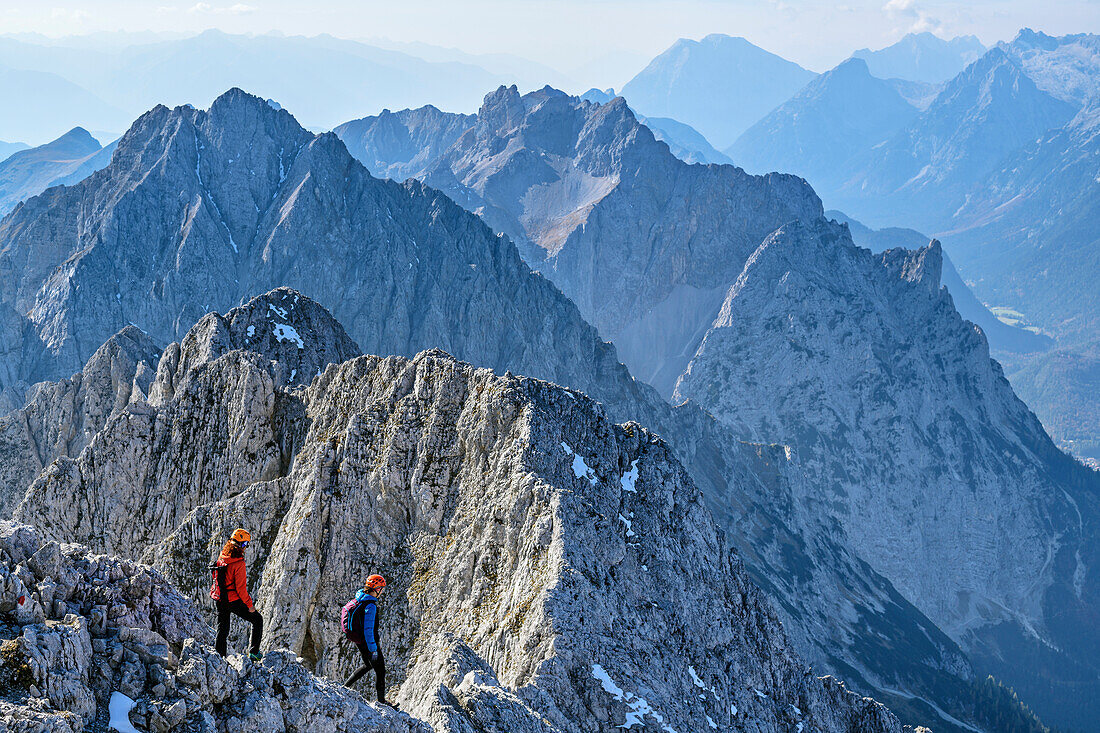 Two women descending from Woerner, Karwendel range in background, Woerner, Karwendel range, Upper Bavaria, Bavaria, Germany
