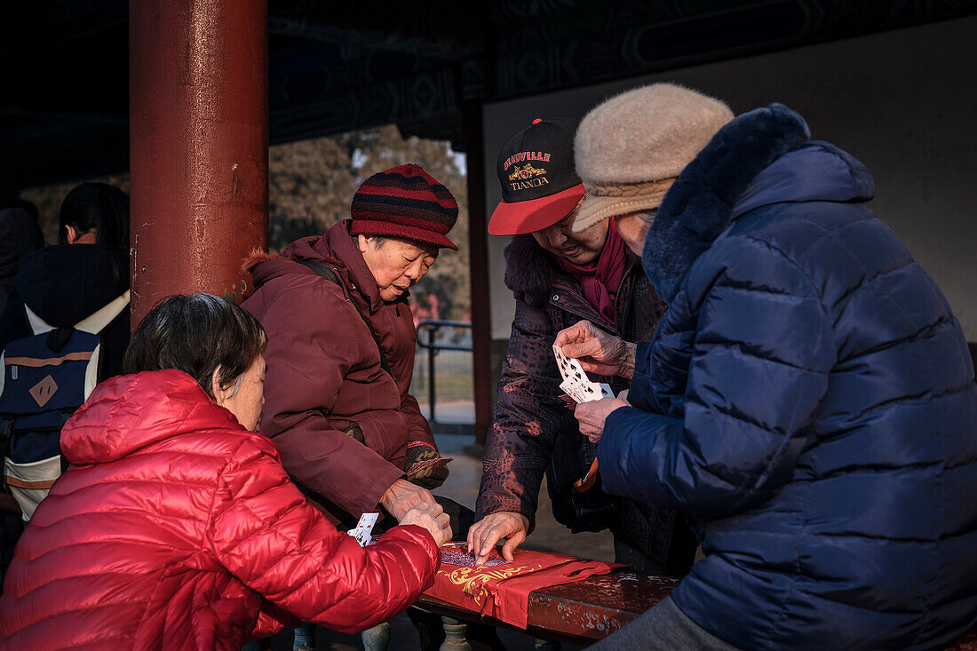 elder chinese women play card games at Temple of the Heaven Park, Beijing, China, Asia, UNESCO World Heritage
