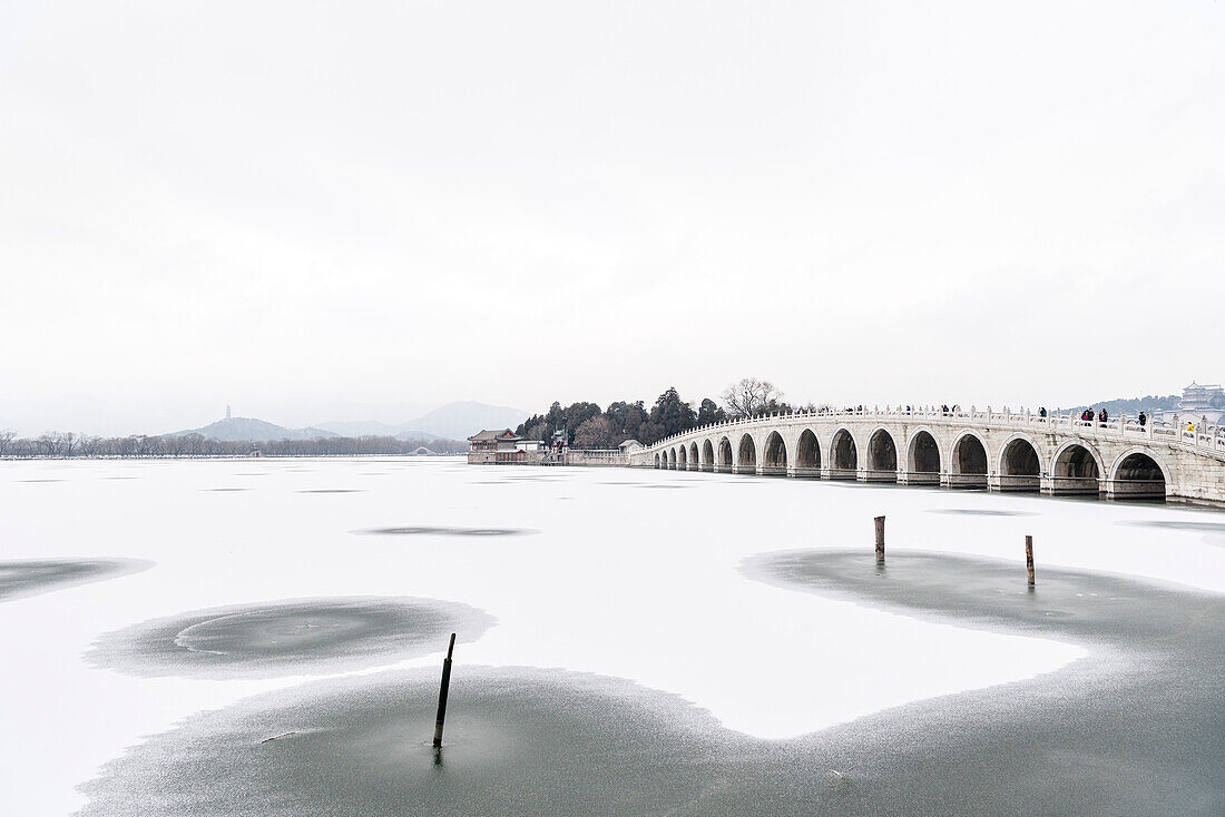 Seventeen Arch bridge leading to Nanhu Island, new Summer Palace in Beijing in Winter, frozen Kunming Lake, China, Asia, UNESCO World Heritage