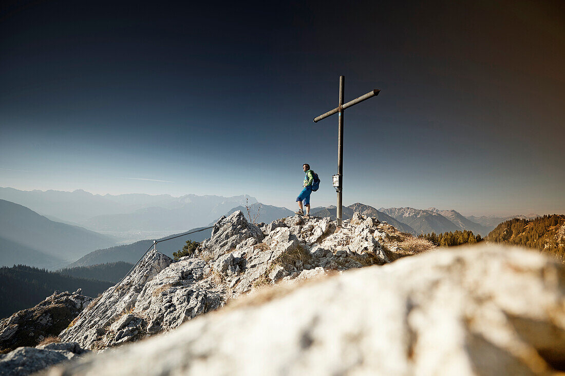 Hiker on Summit of Ettaler Manndl, bavaria