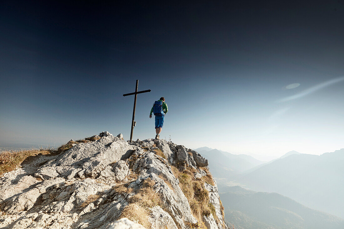 Hiker on Summit of Ettaler Manndl, bavaria