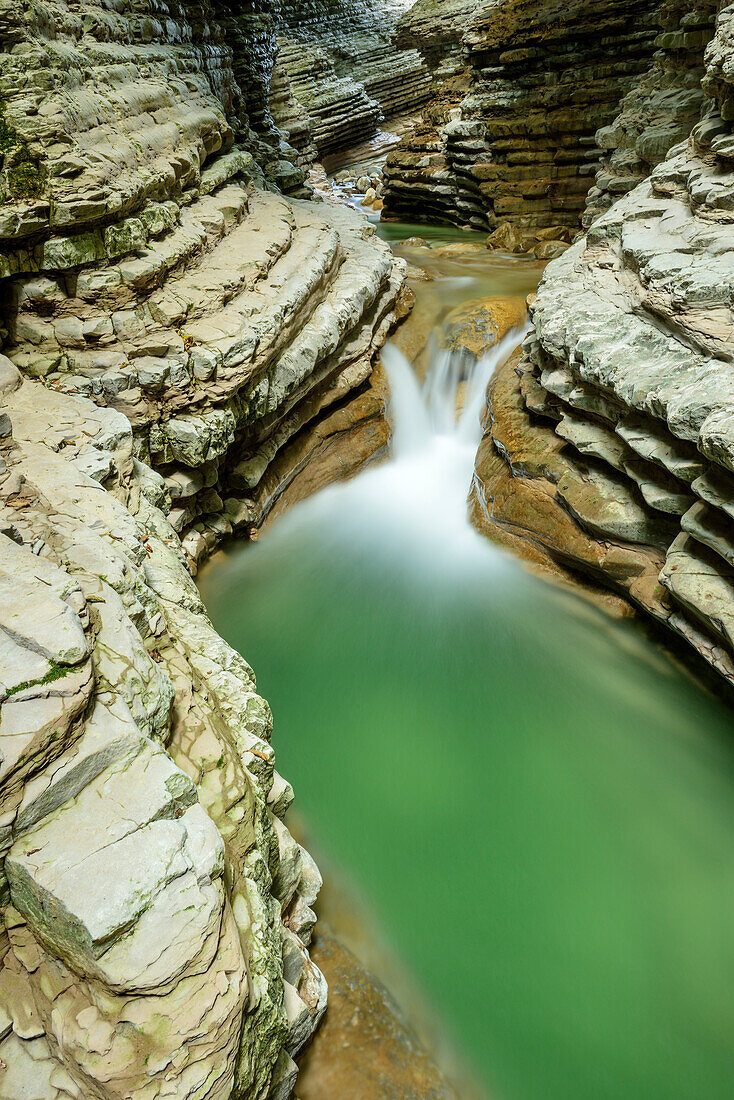 Stream flowing through banded canyon, Brent de l'Art, Venetia, Italy