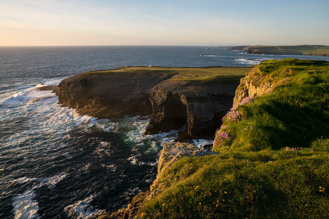 Sunset over the Cliffs of Kilkee and the Atlantic Ocean, Kilkee, County Clare, Ireland, Europe