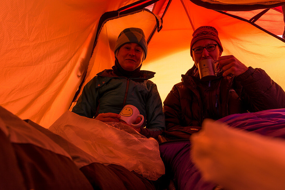 Climber and mountaineer in a tent at the Circo de los Altares, Los Glaciares National Park, Patagonia, Argentina