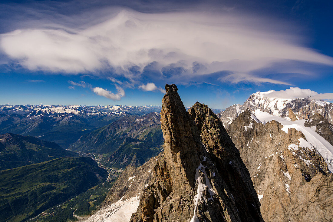 Cloud swirls in the sky, view from the Grandes Jorasses towards Courmayeur, in the background Mont Blanc, Mont Blanc group, France