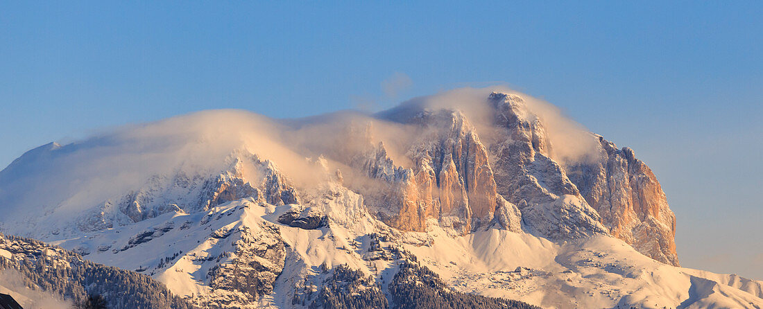 Sassolungo and Sasso Piatto peaks at sunrise. Moena, Val di Fassa, Trentino, Italy.