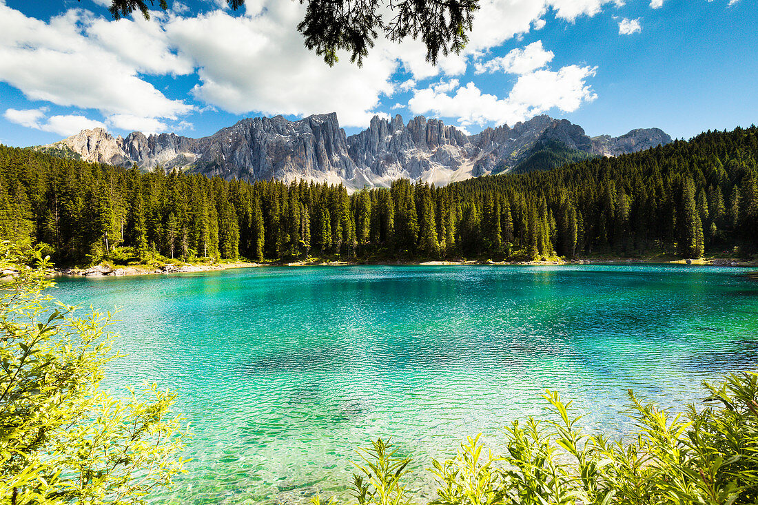 a view of the Karersee with its unique colors and with the Latemar in the background, Bolzano province, South Tyrol, Trentino Alto Adige, Italy,